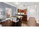 Dining area with an open view of the kitchen with stainless appliances and wooden cabinetry at 2277 Peachtree Ne Rd # 302, Atlanta, GA 30309