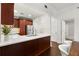 Modern kitchen with a spacious island, wood cabinetry, and stainless steel appliances at 2277 Peachtree Ne Rd # 302, Atlanta, GA 30309
