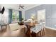 Stylish living room featuring a dining area, paneled accent wall, and outside balcony at 2277 Peachtree Ne Rd # 302, Atlanta, GA 30309