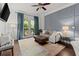 Spacious living room featuring a tv, balcony, neutral tones and tons of natural light at 2277 Peachtree Ne Rd # 302, Atlanta, GA 30309