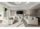 This lounge features two curved couches, decorative pillows, and a wall-mounted tv at 2277 Peachtree Ne Rd # 302, Atlanta, GA 30309