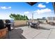 A beautiful patio with outdoor dining and a built-in stainless steel grill at 2277 Peachtree Ne Rd # 302, Atlanta, GA 30309