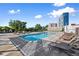 Resort-style pool with lounge chairs and city views at 2277 Peachtree Ne Rd # 302, Atlanta, GA 30309