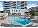 Relaxing pool area with lounge chairs and a whirlpool, perfect for unwinding at 2277 Peachtree Ne Rd # 302, Atlanta, GA 30309