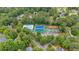 An aerial view features a community pool, tennis courts, a basketball court and playground at 5804 Fairwood Nw Cir, Acworth, GA 30101
