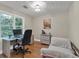This bedroom features a comfortable daybed and a serene workspace for work or study at 5804 Fairwood Nw Cir, Acworth, GA 30101