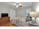 Bedroom with hardwood floors, double closet, and a ceiling fan at 5804 Fairwood Nw Cir, Acworth, GA 30101