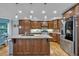 Spacious kitchen with granite countertops, stainless steel appliances, and custom wood cabinetry at 5804 Fairwood Nw Cir, Acworth, GA 30101