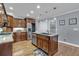 Updated kitchen with center island, stainless steel appliances, hardwood floors and grey walls at 5804 Fairwood Nw Cir, Acworth, GA 30101