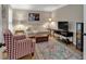 Cozy living room featuring hardwood floors, neutral colors, and ambient lighting at 5804 Fairwood Nw Cir, Acworth, GA 30101