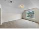 Bonus room with carpeting, a large window, and neutral walls at 1792 Portwest Way, Hampton, GA 30228