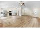 Modern kitchen open to the living room, featuring stainless steel appliances and hardwood floors, ready for cooking at 1792 Portwest Way, Hampton, GA 30228