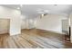 Spacious living room with hardwood floors, neutral walls, and recessed lighting, ideal for entertaining at 1792 Portwest Way, Hampton, GA 30228