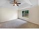 The main bedroom has new carpet, neutral walls, and a large window for ample light at 1792 Portwest Way, Hampton, GA 30228