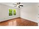 Bedroom with a ceiling fan and large window at 1980 Heatherton Rd, Dacula, GA 30019