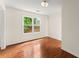 Light-filled bedroom with hardwood floors and a large window offering pleasant views at 1980 Heatherton Rd, Dacula, GA 30019