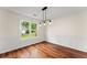 Charming dining room featuring beautiful hardwood floors and natural light at 1980 Heatherton Rd, Dacula, GA 30019