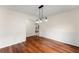 Cozy dining room with decorative wall panels and sleek hardwood flooring at 1980 Heatherton Rd, Dacula, GA 30019