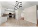 Bright eat-in kitchen featuring stainless steel appliances, tile flooring, and modern lighting at 1980 Heatherton Rd, Dacula, GA 30019