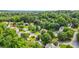 An aerial view of the neighborhood with mature trees, landscaping, and well maintained streets at 11260 Havenwood Dr, Johns Creek, GA 30097