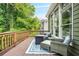 Relaxing outdoor living space with wicker furniture and fire pit on a wood deck at 11260 Havenwood Dr, Johns Creek, GA 30097