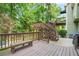 Multi-level wooden deck with bench seating and stairs to the yard, perfect for outdoor entertaining at 11260 Havenwood Dr, Johns Creek, GA 30097