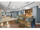 Finished basement bar with wooden counter, seating, shelving, and wood-look tile flooring at 11260 Havenwood Dr, Johns Creek, GA 30097