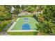 A well-maintained basketball court with benches in a lush, green park setting at 11260 Havenwood Dr, Johns Creek, GA 30097