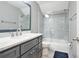 Bathroom features a marble-tiled shower with a sleek glass door and a vanity with a marble countertop at 11260 Havenwood Dr, Johns Creek, GA 30097