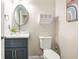 Powder room featuring vessel sink, decorative wall art, and a modern vanity with dark wood cabinets at 11260 Havenwood Dr, Johns Creek, GA 30097