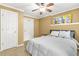 Cozy bedroom features a ceiling fan, neutral walls, and a comfortable queen bed at 11260 Havenwood Dr, Johns Creek, GA 30097