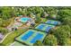 Overhead view showing community pool, tennis courts and lush green spaces at 11260 Havenwood Dr, Johns Creek, GA 30097
