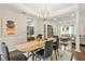 Dining room featuring a modern chandelier and views into the living room at 11260 Havenwood Dr, Johns Creek, GA 30097