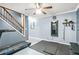 Home gym featuring a treadmill, weight bench, full length mirrors, and wooden stairs at 11260 Havenwood Dr, Johns Creek, GA 30097