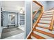 Home gym featuring a weight bench, full length mirrors, and wood stairs at 11260 Havenwood Dr, Johns Creek, GA 30097