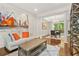 Inviting living room with hardwood floors, decorative pillars and lots of natural light from dining room at 11260 Havenwood Dr, Johns Creek, GA 30097