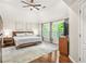 Bright main bedroom with hardwood floors, king size bed, and abundant natural light at 11260 Havenwood Dr, Johns Creek, GA 30097