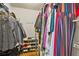 Spacious walk-in closet offers ample storage space with clothing racks, shelving and a shoe rack at 11260 Havenwood Dr, Johns Creek, GA 30097
