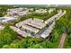 Aerial view of townhome community surrounded by lush green trees at 1529 Liberty Nw Pkwy, Atlanta, GA 30318