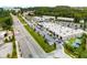 Expansive aerial view of a commercial district featuring diverse businesses, parking lots, and lush green spaces with mature trees at 1529 Liberty Nw Pkwy, Atlanta, GA 30318