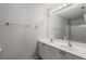 Well-lit bathroom features a double sink vanity with chrome fixtures and a large mirror at 1529 Liberty Nw Pkwy, Atlanta, GA 30318