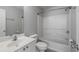 Full bathroom has white vanity, commode, and tub/shower combo at 1529 Liberty Nw Pkwy, Atlanta, GA 30318
