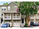 Charming townhouse showcasing front balconies and well-maintained landscaping at 1529 Liberty Nw Pkwy, Atlanta, GA 30318