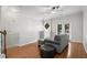 Relaxing upstairs living area with a ceiling fan, diamond window, and french doors at 1529 Liberty Nw Pkwy, Atlanta, GA 30318