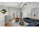 Cozy upstairs living area with a ceiling fan, diamond window, and french doors at 1529 Liberty Nw Pkwy, Atlanta, GA 30318
