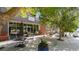 Restaurant exterior with tables and chairs outside under trees and near building entrance at 1529 Liberty Nw Pkwy, Atlanta, GA 30318