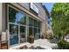Modern storefront of Flour + Time featuring large windows, planters, and accessible entrance in urban setting at 1529 Liberty Nw Pkwy, Atlanta, GA 30318