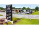 Street view of village with attractive landscaping, signage, and a variety of businesses catering to local residents at 1529 Liberty Nw Pkwy, Atlanta, GA 30318