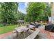 Spacious backyard with a picnic table, outdoor seating, and a fire pit, perfect for entertaining at 2904 Masonwood Nw Dr, Kennesaw, GA 30152