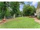 Expansive backyard featuring a large lawn, play area, fire pit, and a storage shed at 2904 Masonwood Nw Dr, Kennesaw, GA 30152